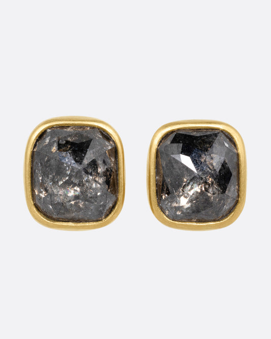 A pair of yellow gold square salt and pepper stud earrings, shown from the front.