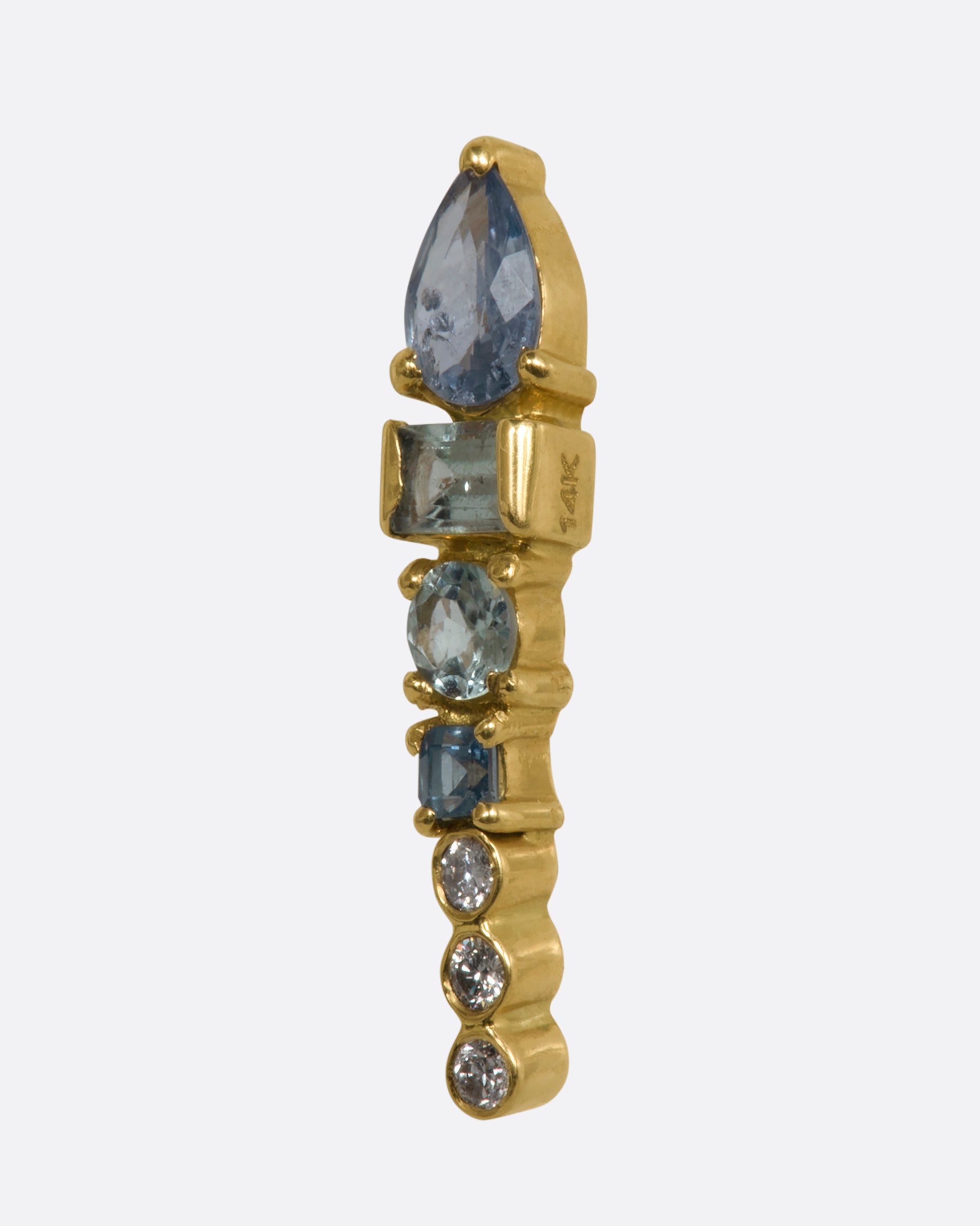 A long stud earring with an aquamarine, tanzanite, apatite, and three round diamonds stacked. Shown from the side.