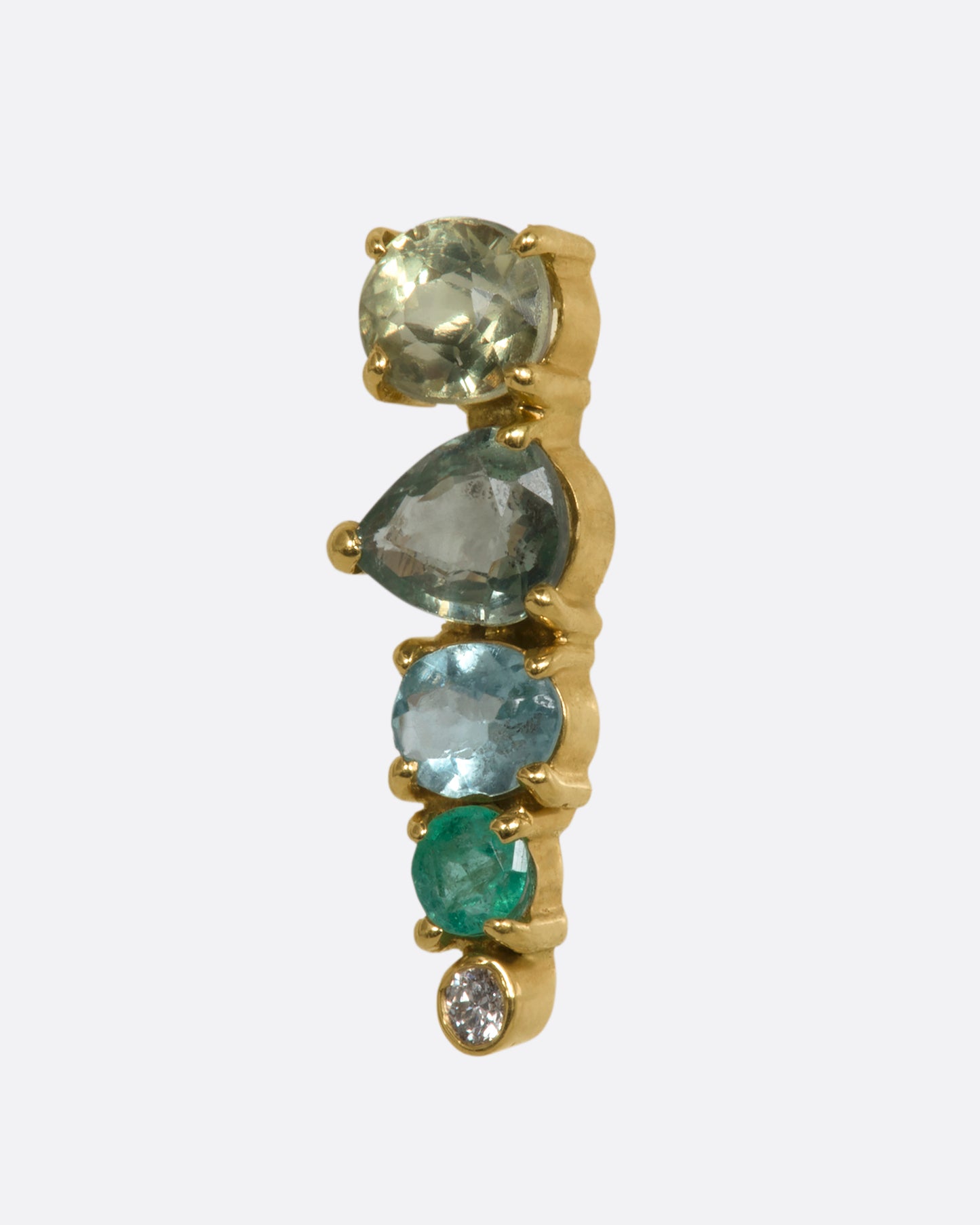 A yellow gold stud earring with a mosaic of emerald, sapphire, tourmalines and diamonds. Shown from the side.