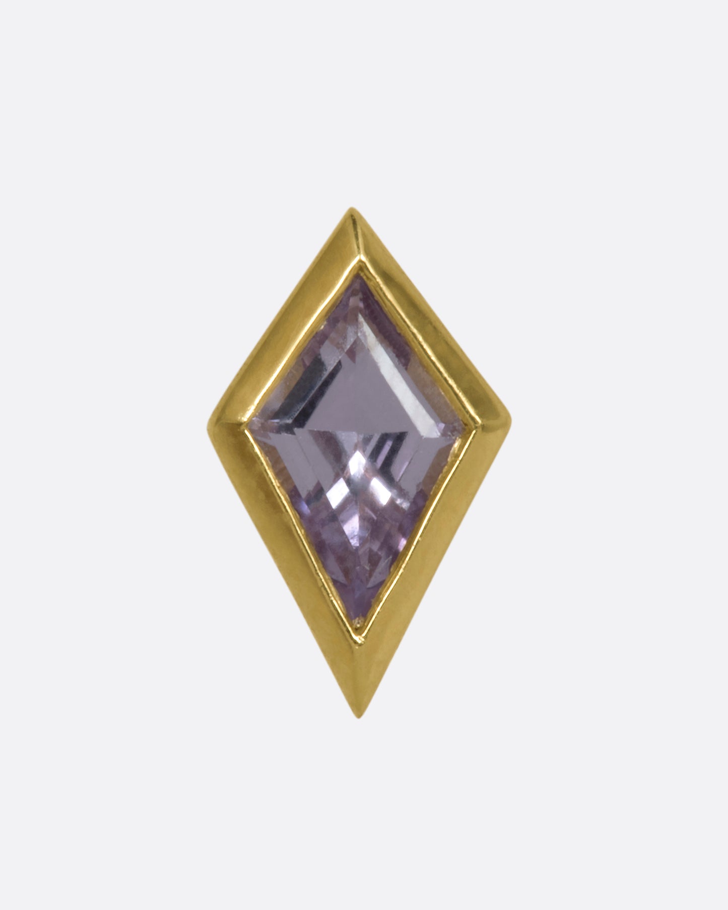 A yellow gold kite shaped stud with a bezel set sapphire.