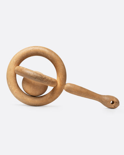 Vintage hand-carved wooden baby rattle, a ring around a loose wooden ball, with a short handle