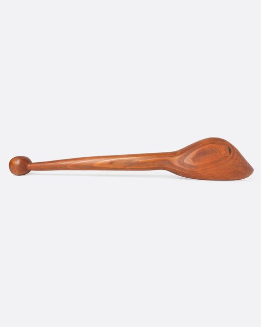 An artist-made wooden animal baton, shown from the side.