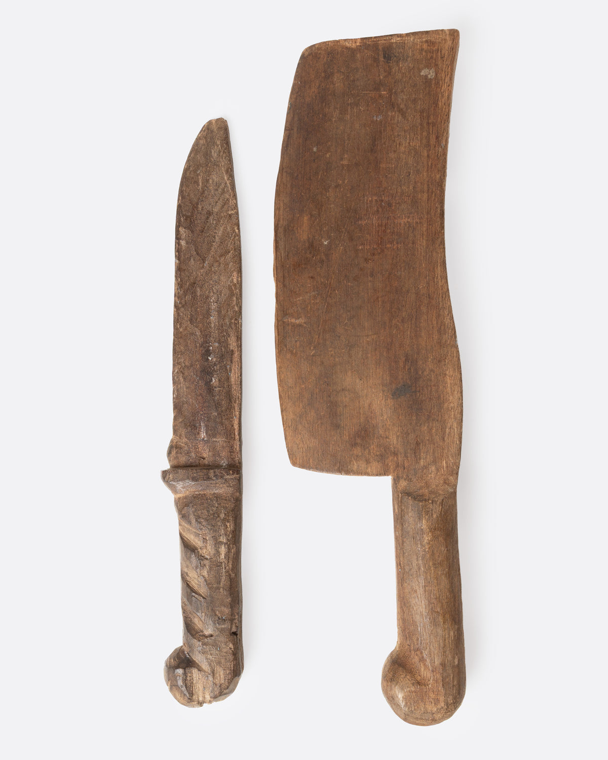 A hand carved wooden knife and cleaver set, shown from the side.