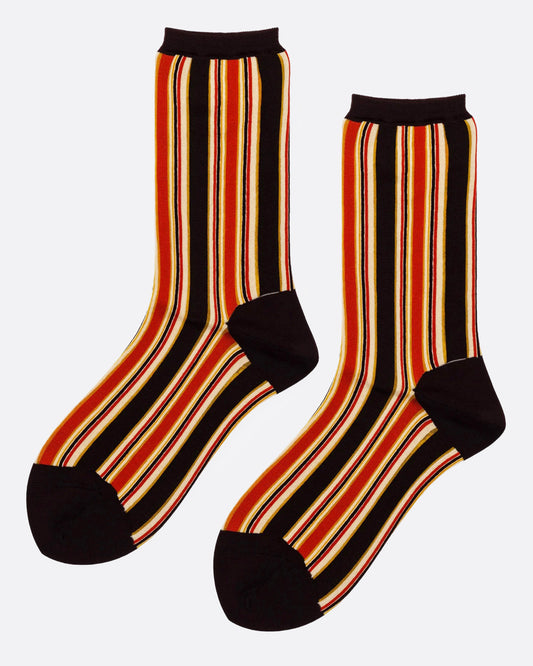 A pair of crew socks with vertical stripes in black, orange, red, and yellow, featuring solid black heels, toes, and ribbed black cuffs, shown from the side.