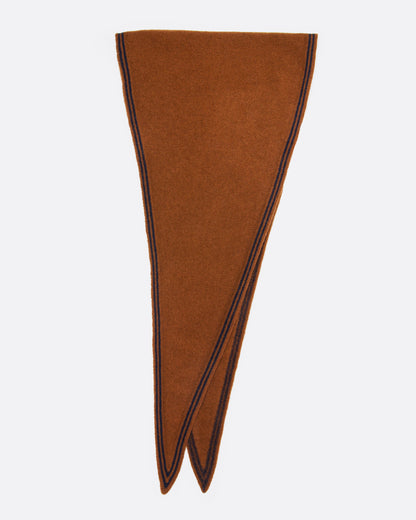 An orange knit scarf with  a navy striped border, shown folded in half.
