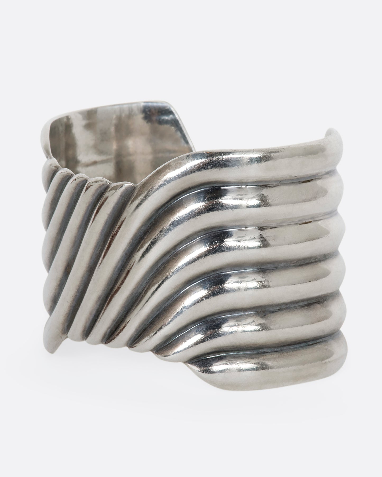 Sterling silver wavy line cuff. View from the side.