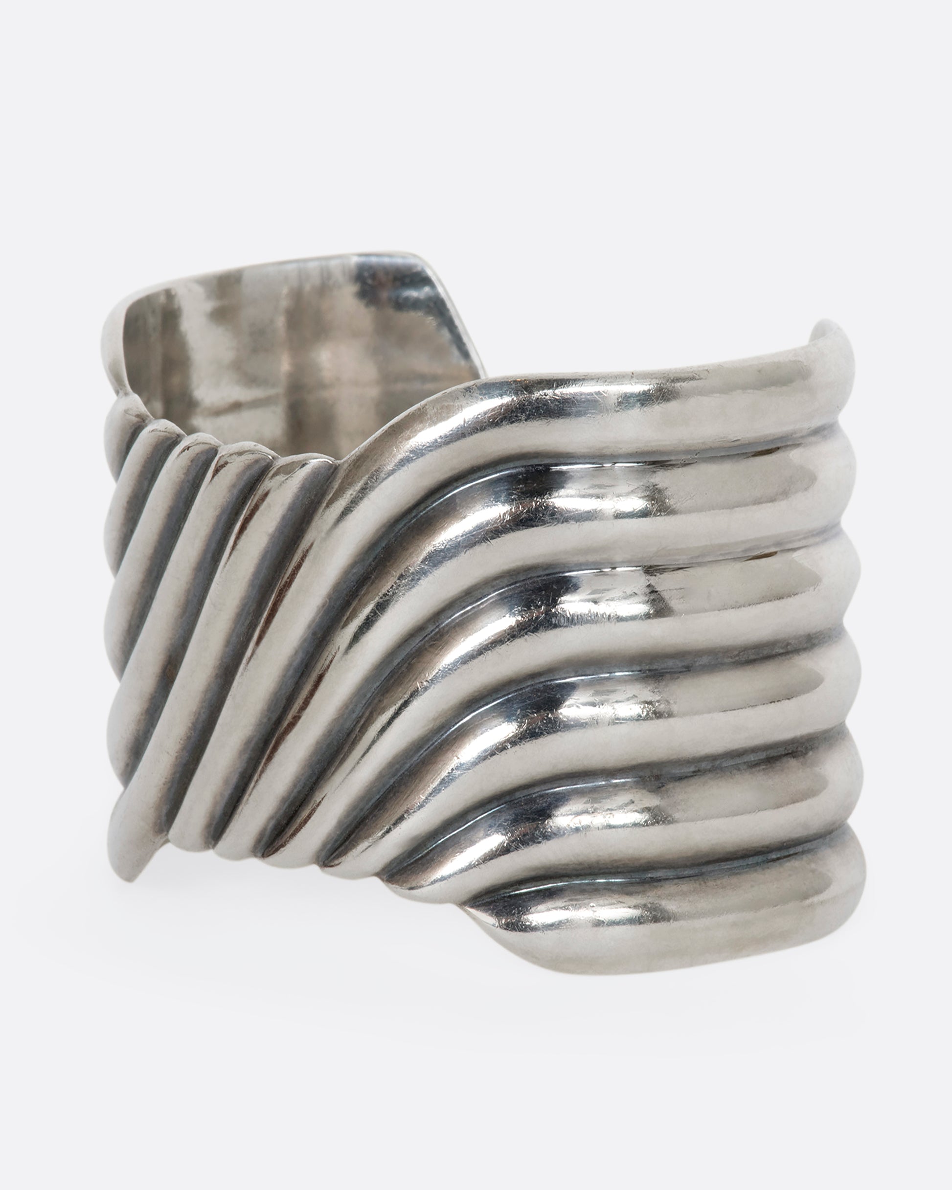 Sterling silver wavy line cuff. View from the side.