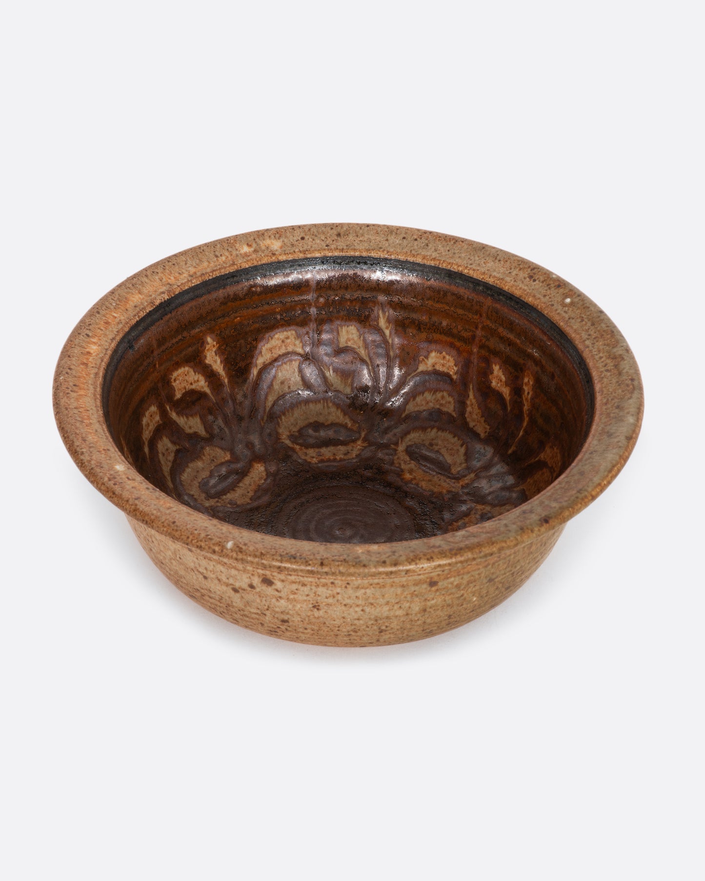 A ceramic lipped bowl with a painted interior. View from above.