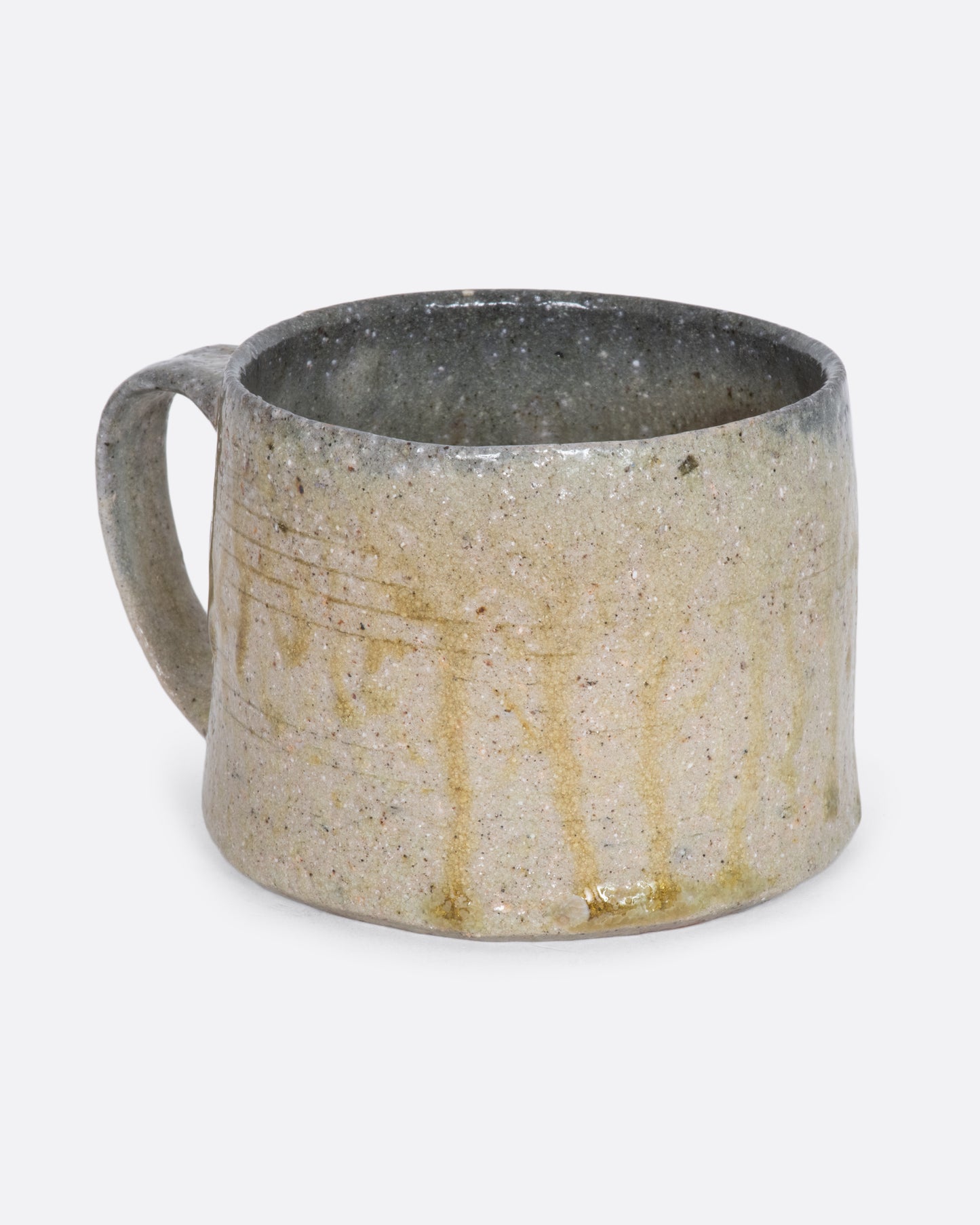 A brown and beige colored hand thrown ceramic mug. View from the alternate side.