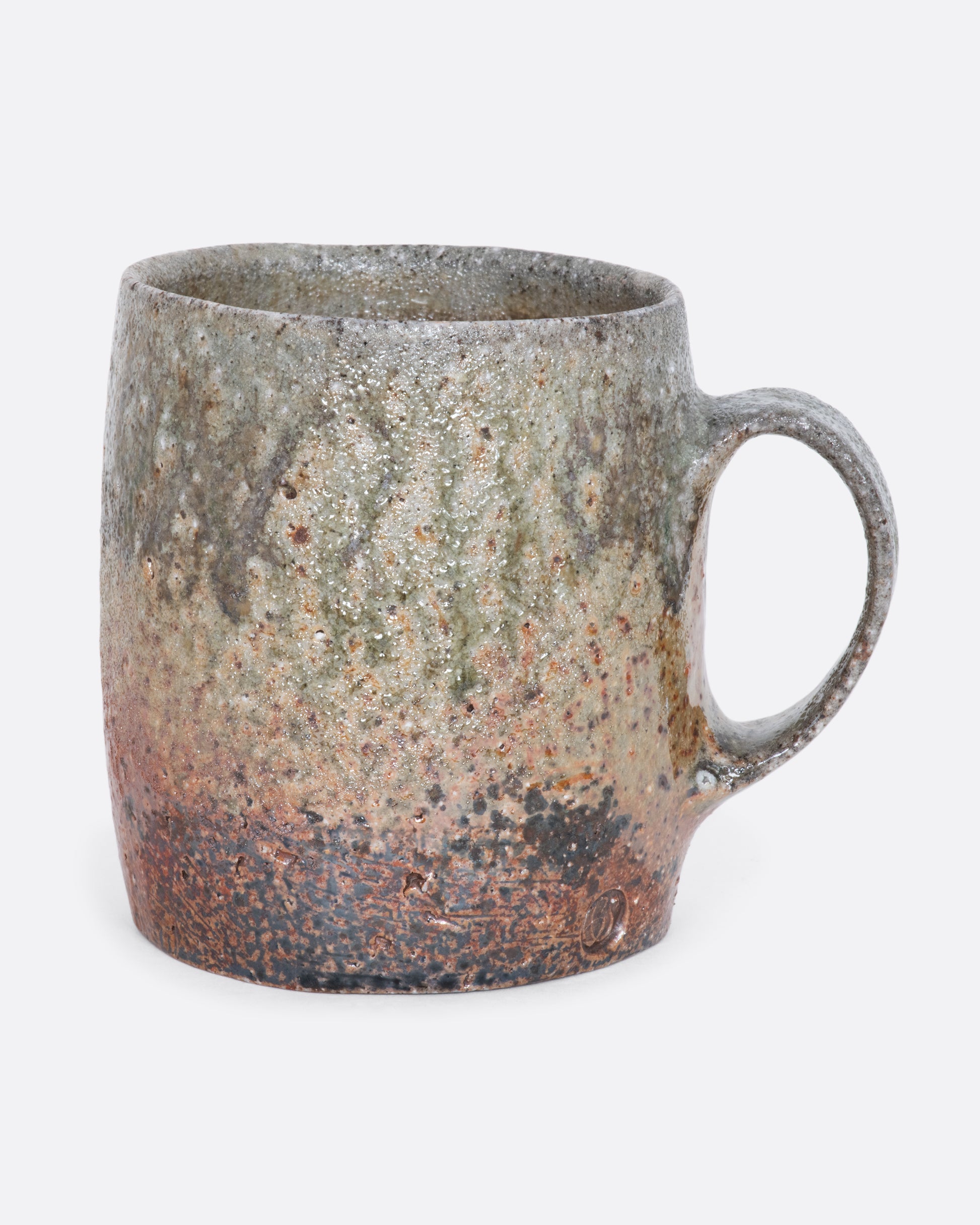 Brown ceramic hand thrown mug. Alternated side view.