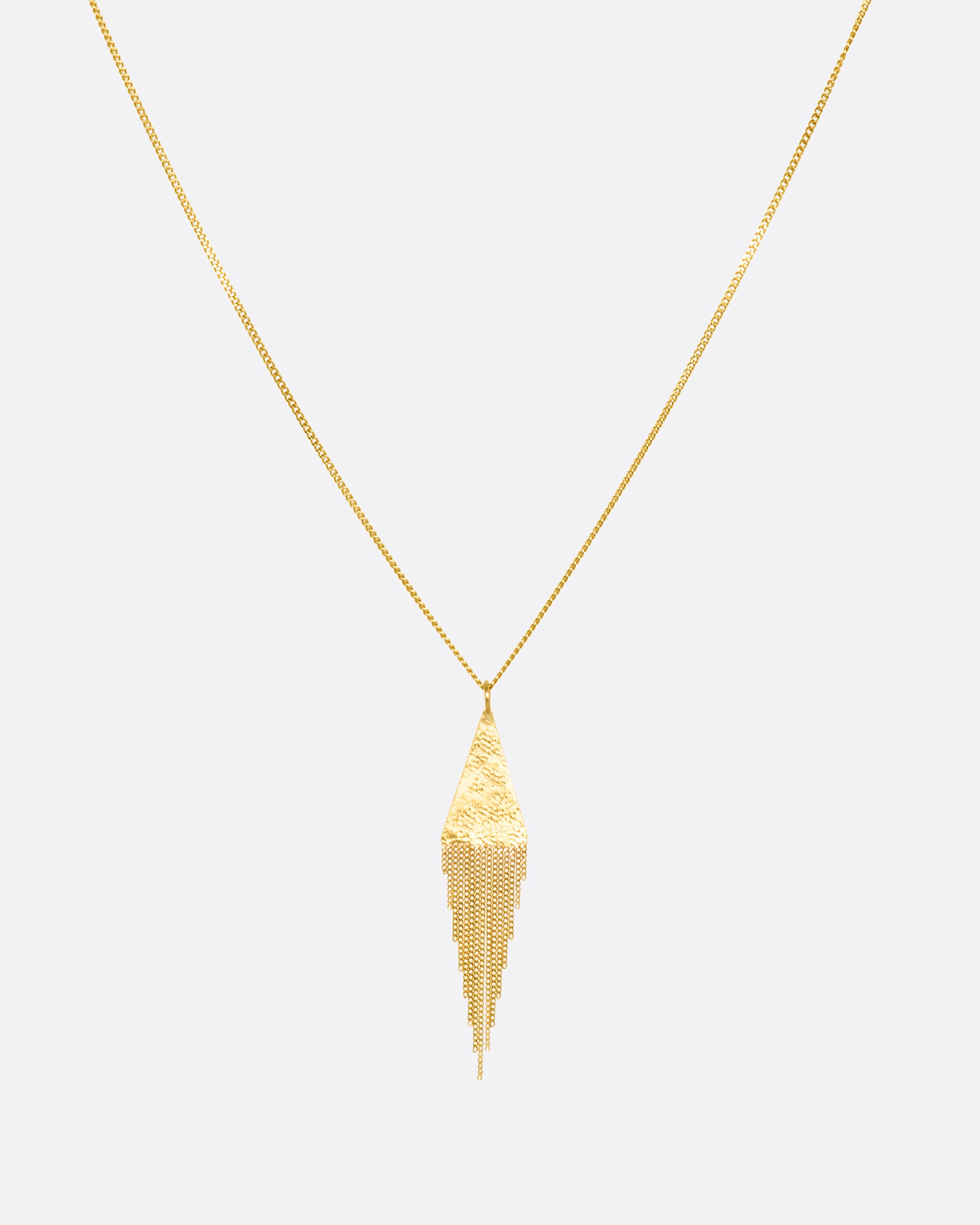A yellow gold necklace with a fringed triangle pendant. View from the front.