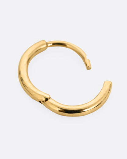 A yellow gold hoop earring with a hinged clicker clasp, shown open from the side.