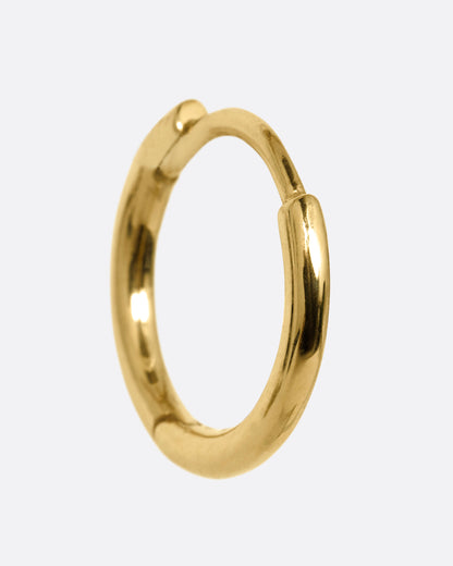 A yellow gold hoop earring with a hinged clicker clasp, shown from the side.