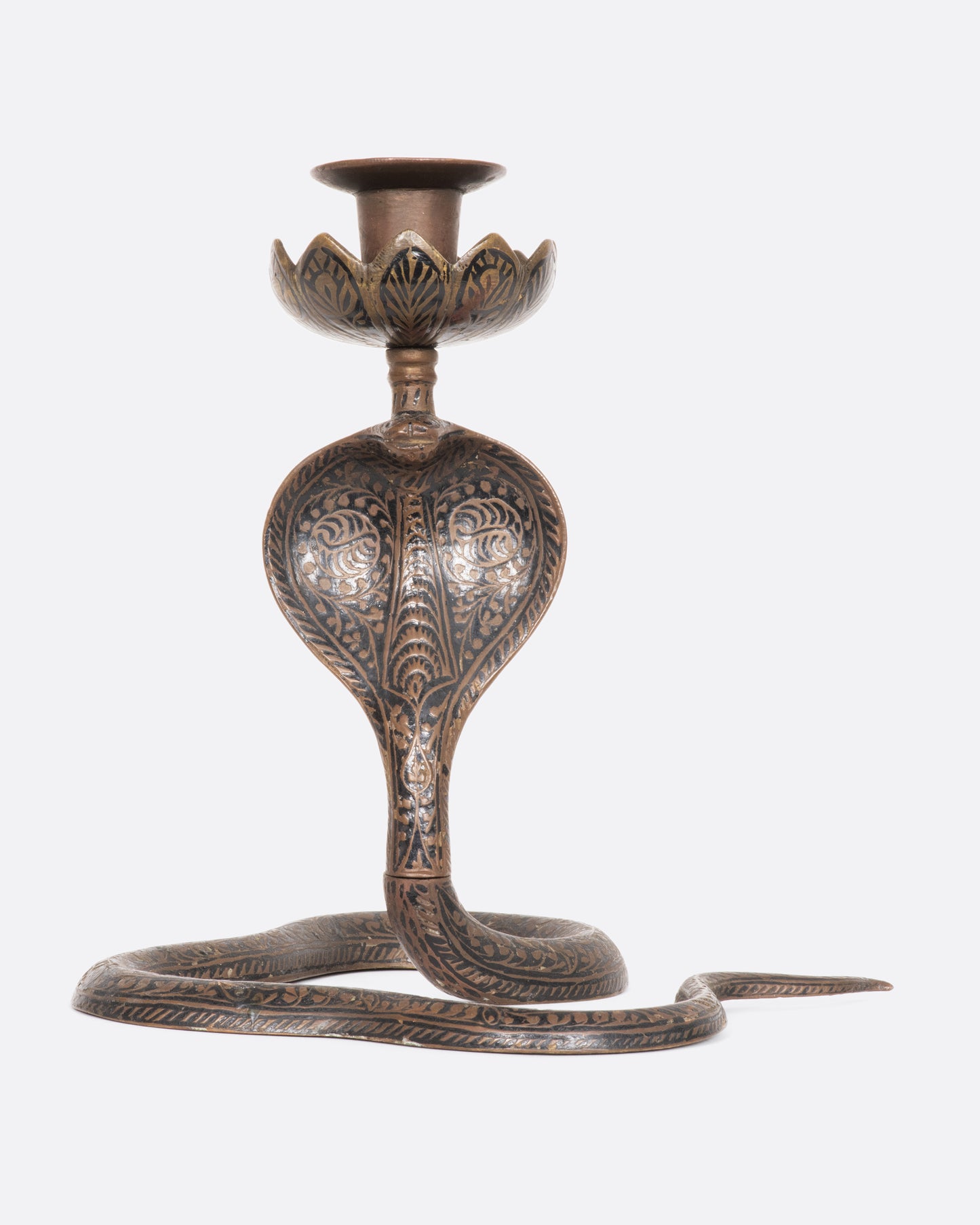 A brass and niello candle holder. View from the front.