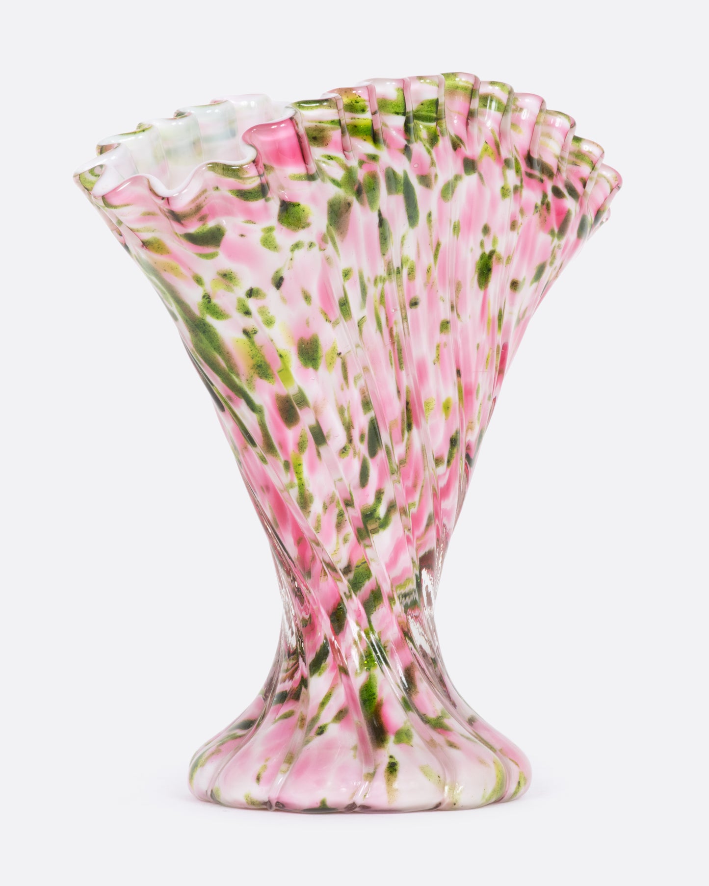 Rippled pink glass vase with green aventurine splatter. View from the side.