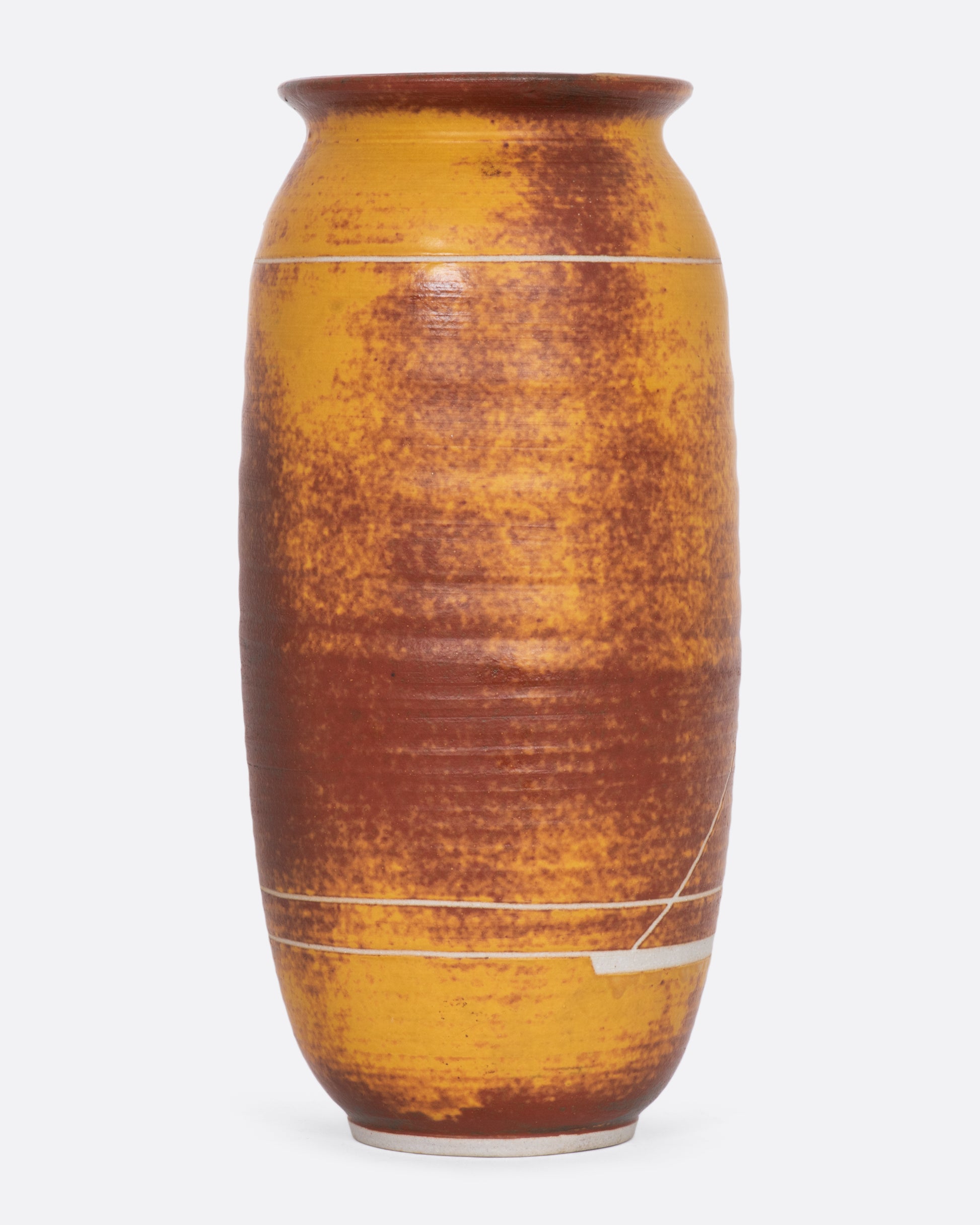 Golden yellow and brown ceramic vase with a sailboat. View from the back.