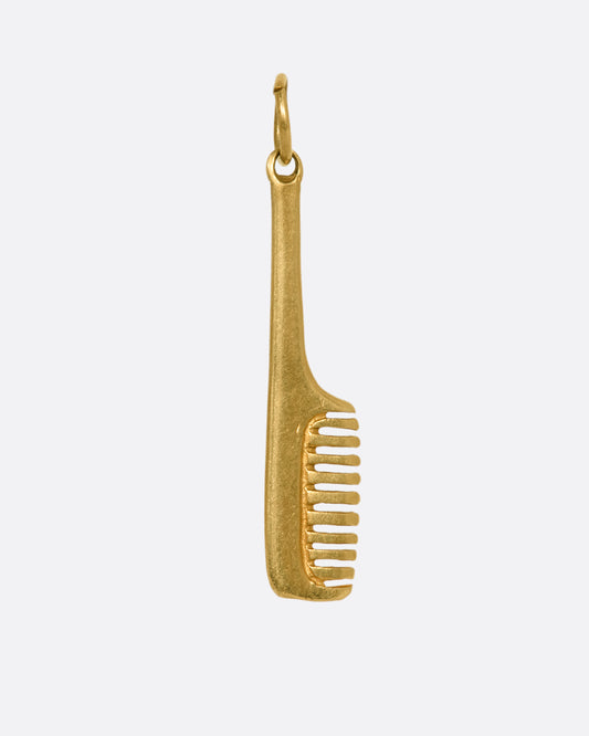 A yellow gold handled comb charm. View from the front.