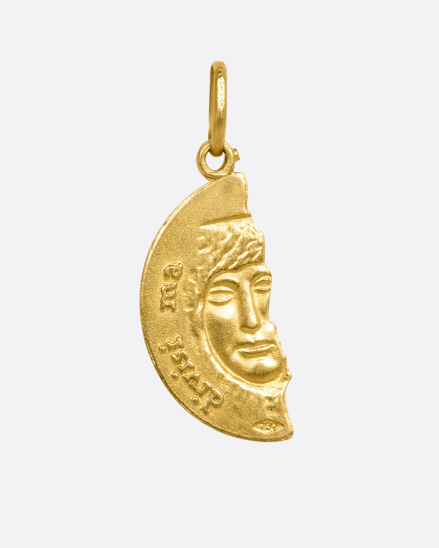 A yellow gold pendant with half a face. View from the back.