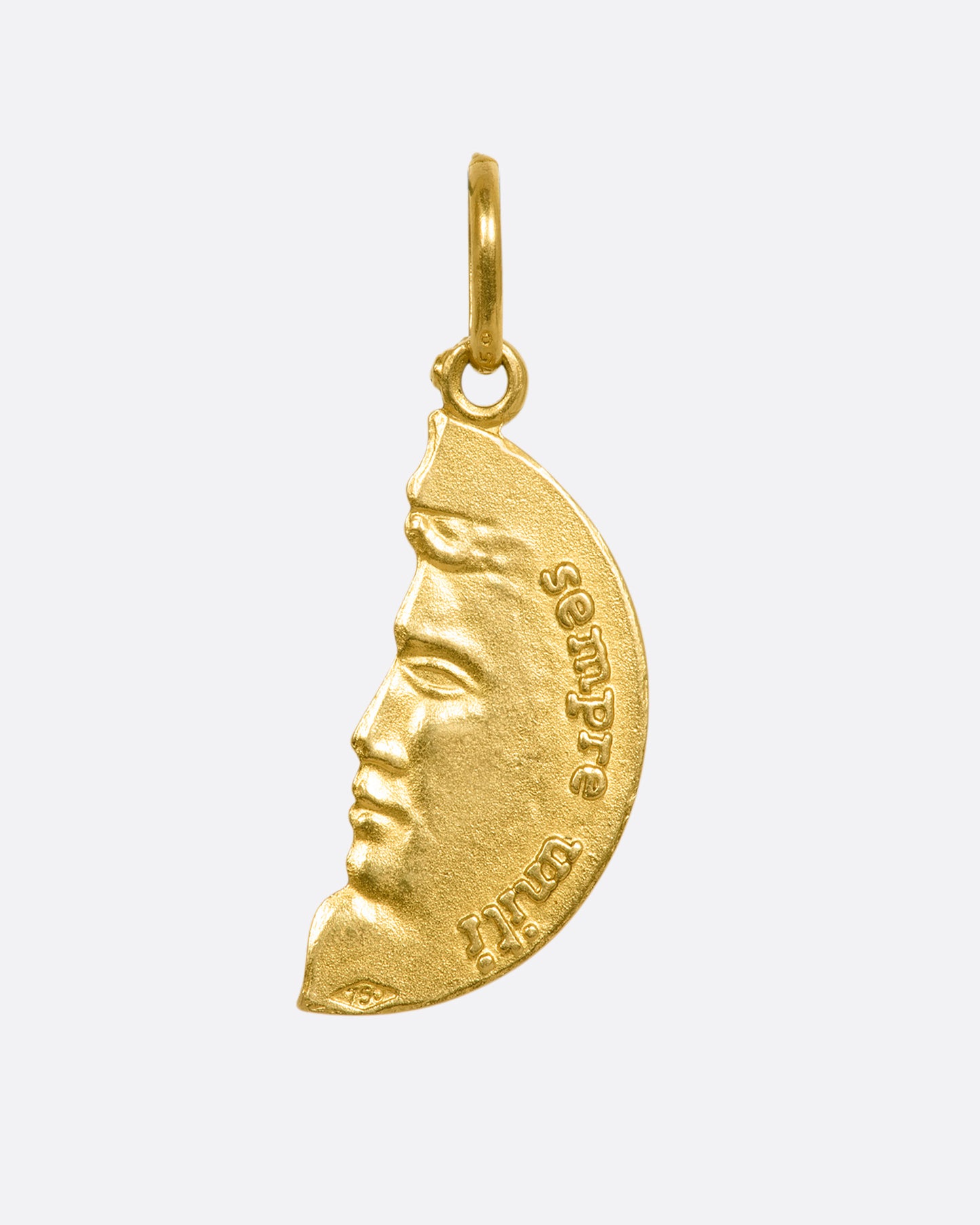 A yellow gold half circle pendant with a face profile. View from the back.