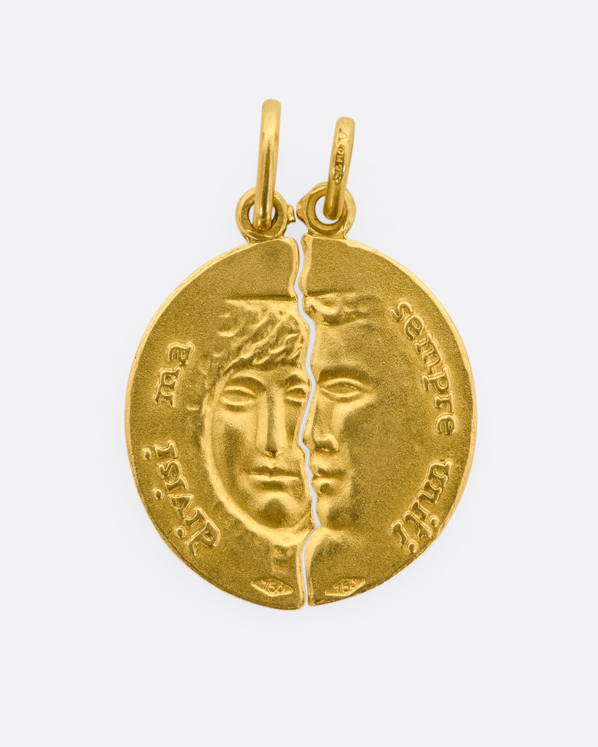 A yellow gold pendant with half a face. View with the second half.