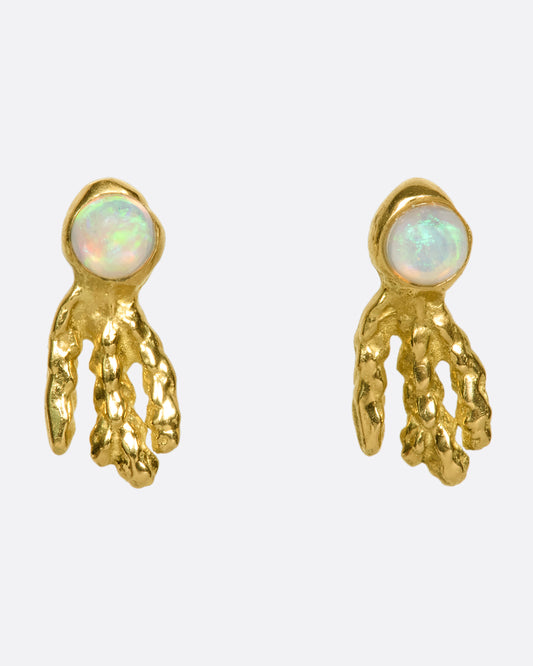 18k gold and opal small drop earrings that look like a glowing sea creatures swimming across your ear