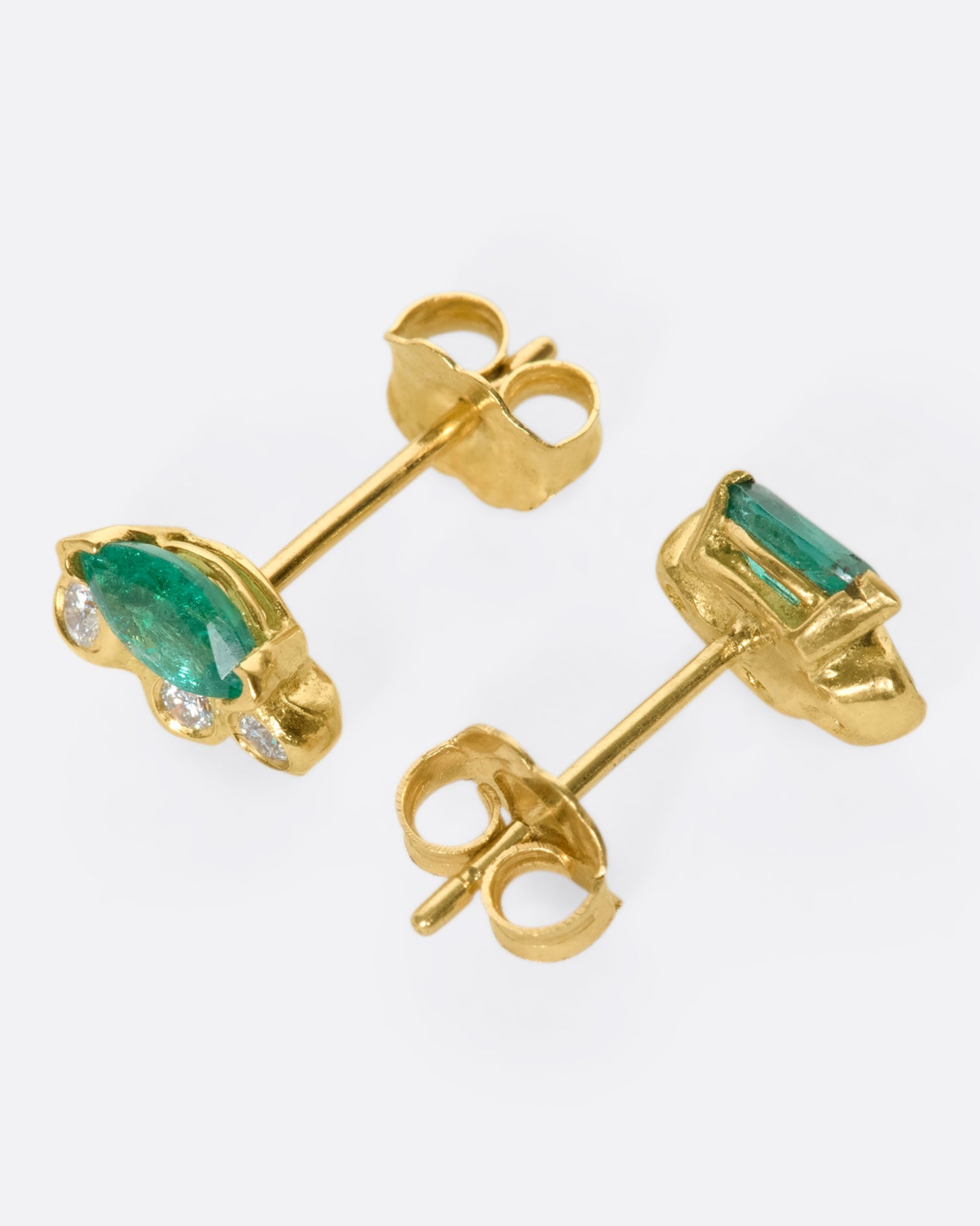 Marquise emerald and diamond studs wrapped in 18k gold