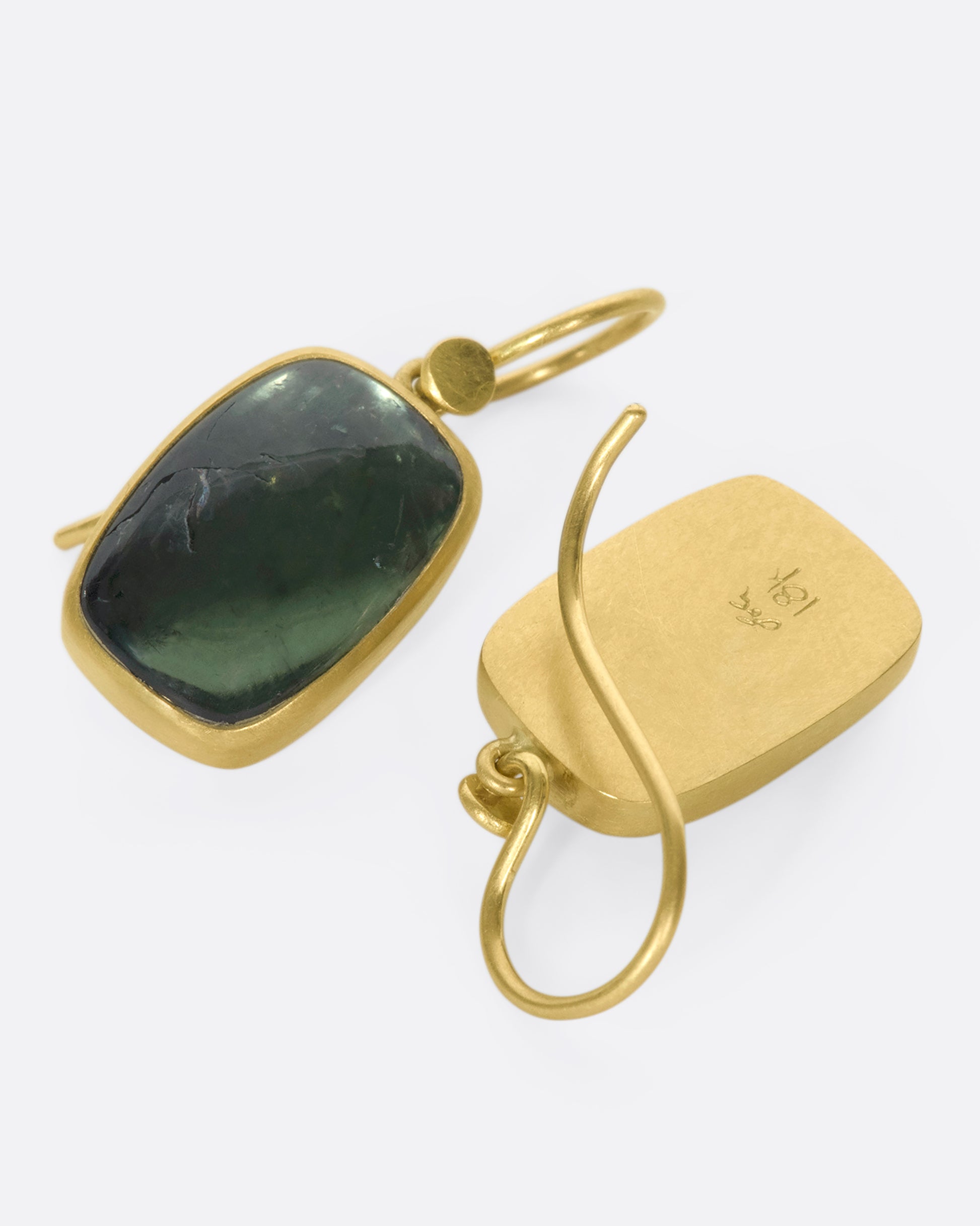 18k gold drops with green tourmaline chiclets. A gold bezel wraps the translucsent forrest green stone with stunning contrast that makes the tourmaline truly pop.