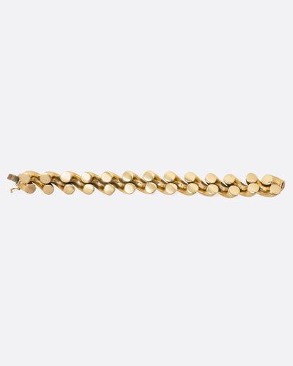 Vintage yellow gold twist bracelet, back of the bracelet laid flat, showing the underside of the links