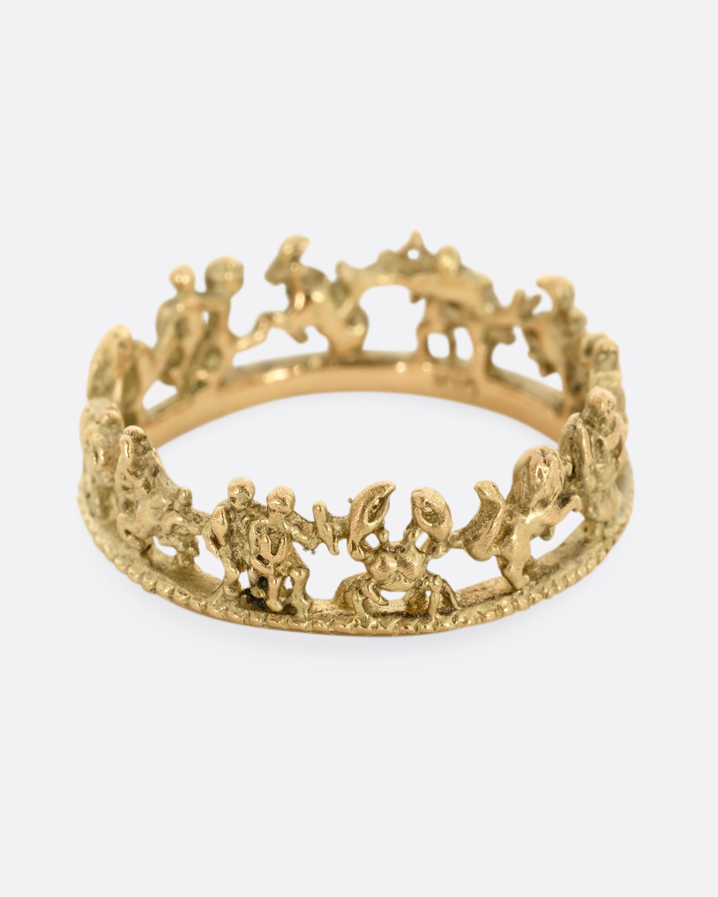 A yellow gold ring with every zodiac character around the entire band.