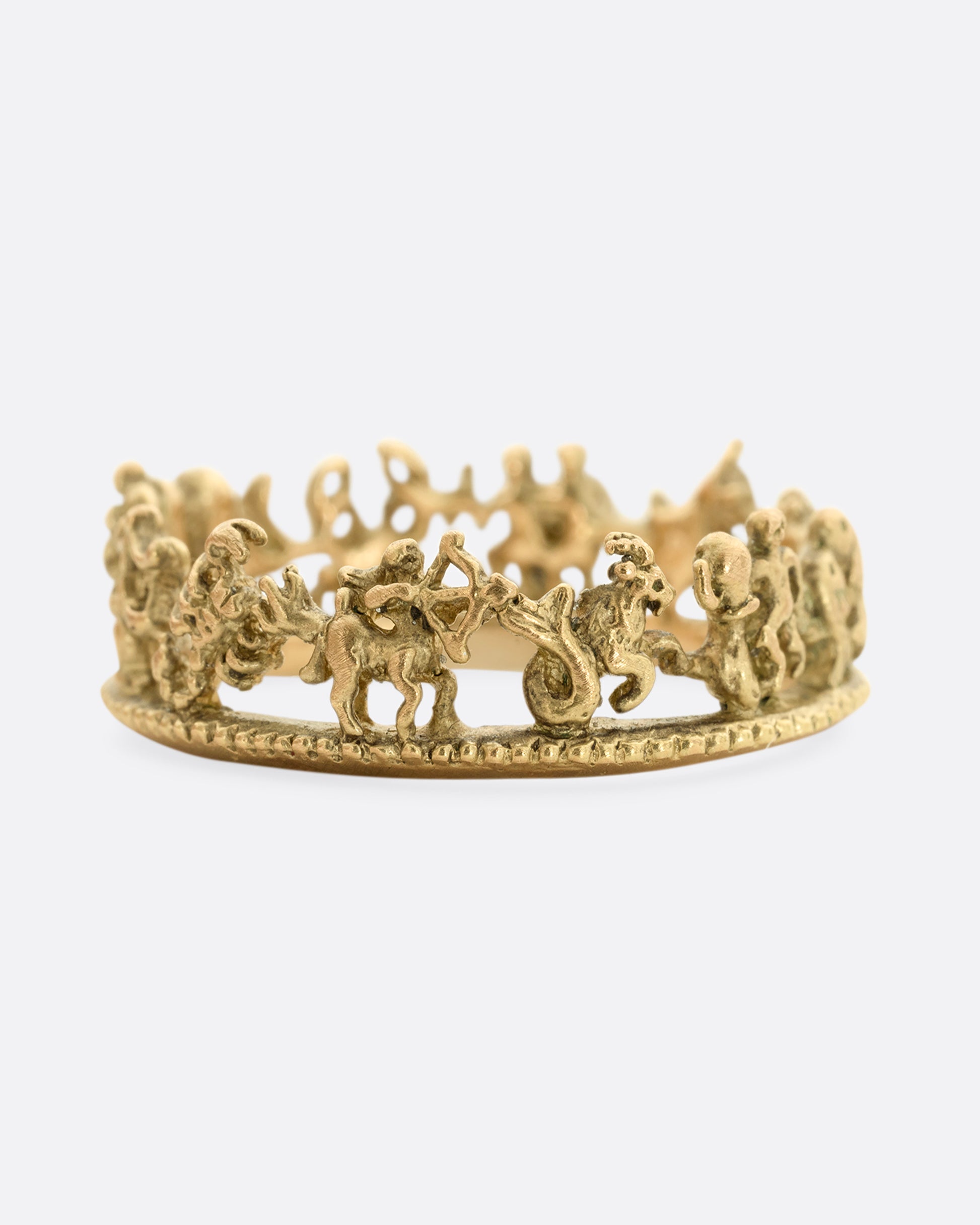 A yellow gold ring with every zodiac character around the entire band.