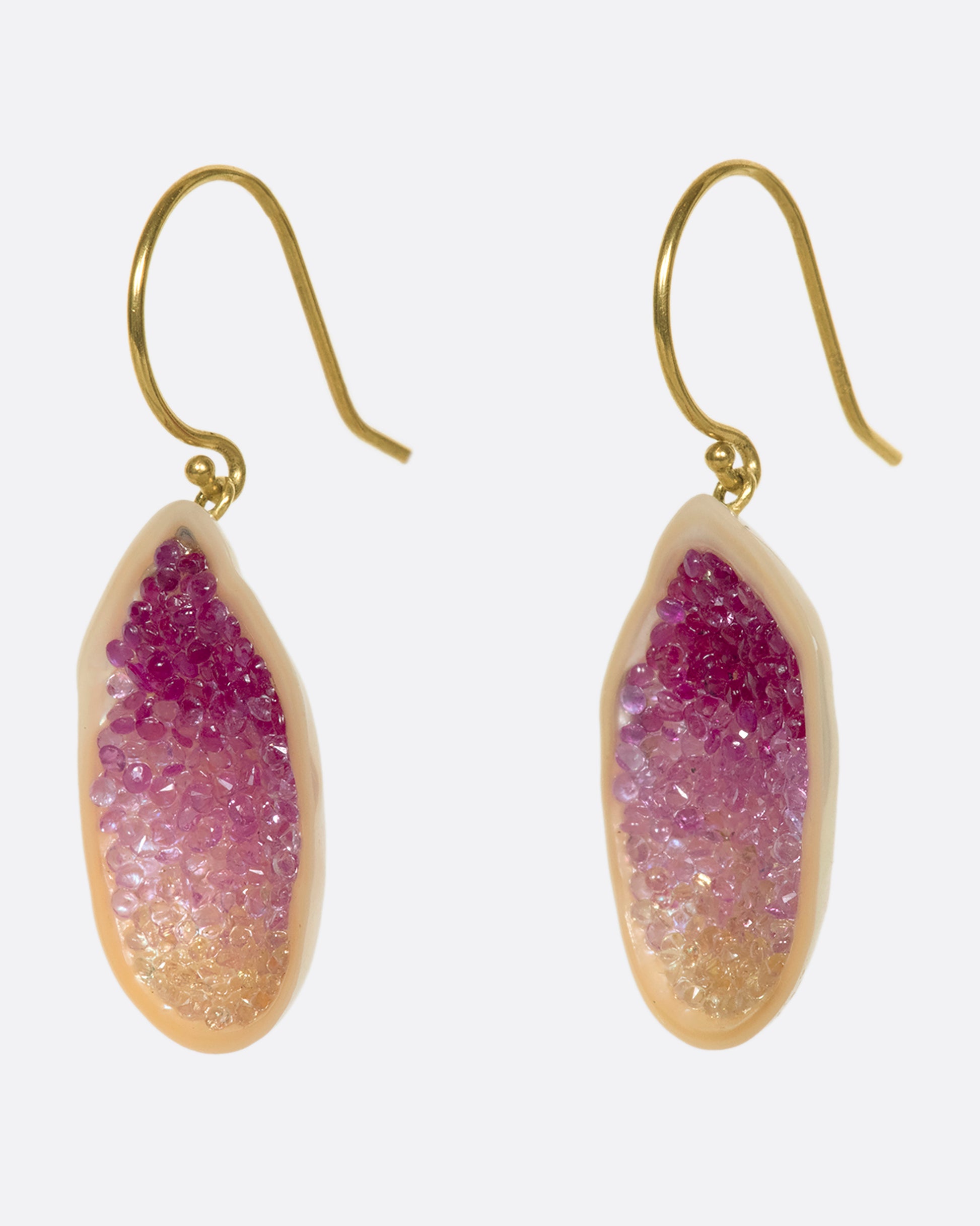 The smooth, soft pearls are lined with reclaimed pink and yellow ombre sapphires