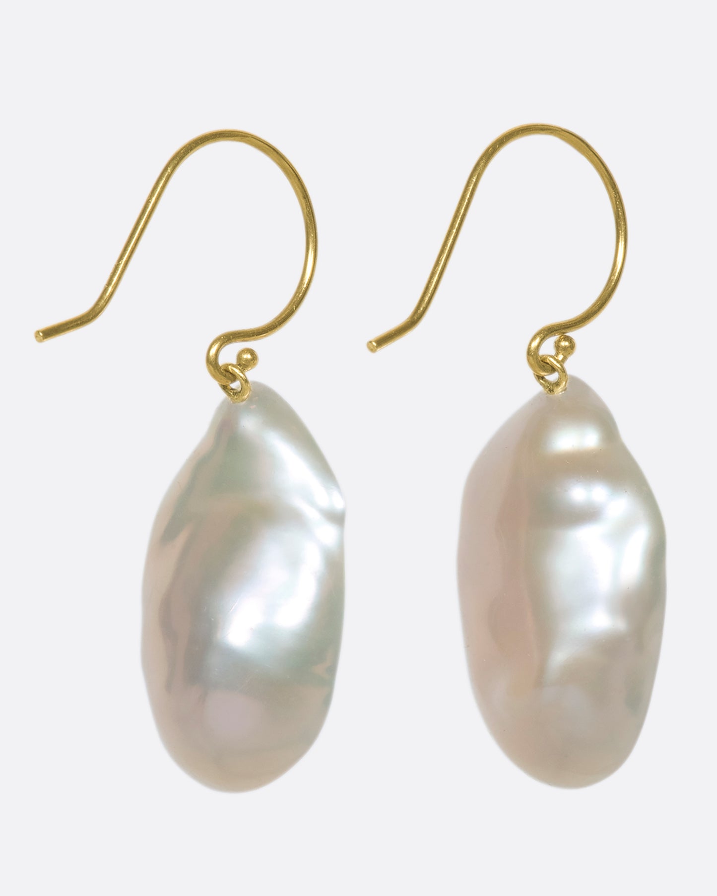 The smooth, soft pearls are lined with reclaimed pink and yellow ombre sapphires