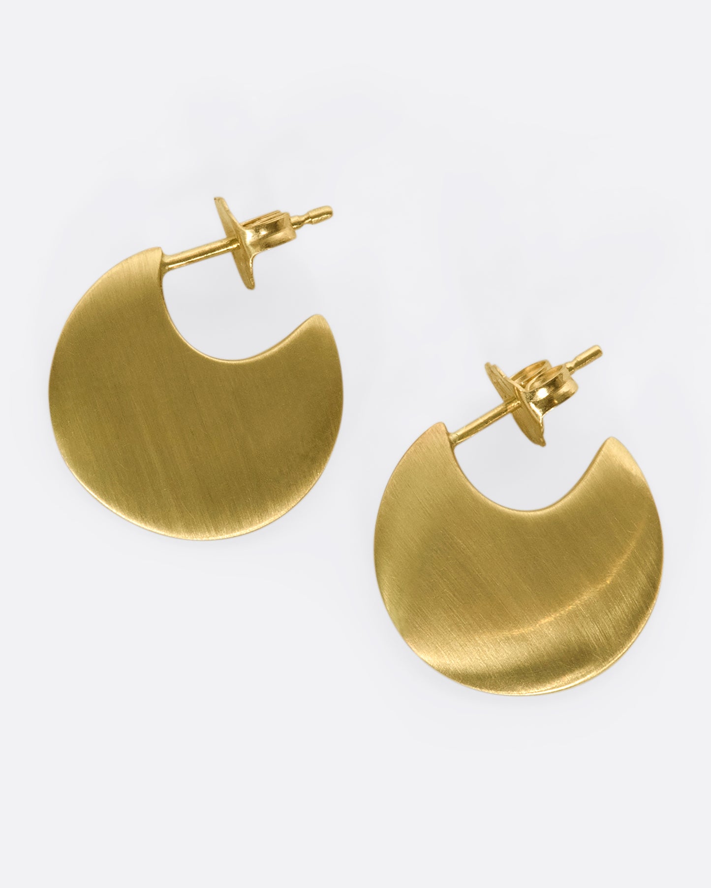 From the front, this pair of 10K solid gold hoop earrings look razor thin.