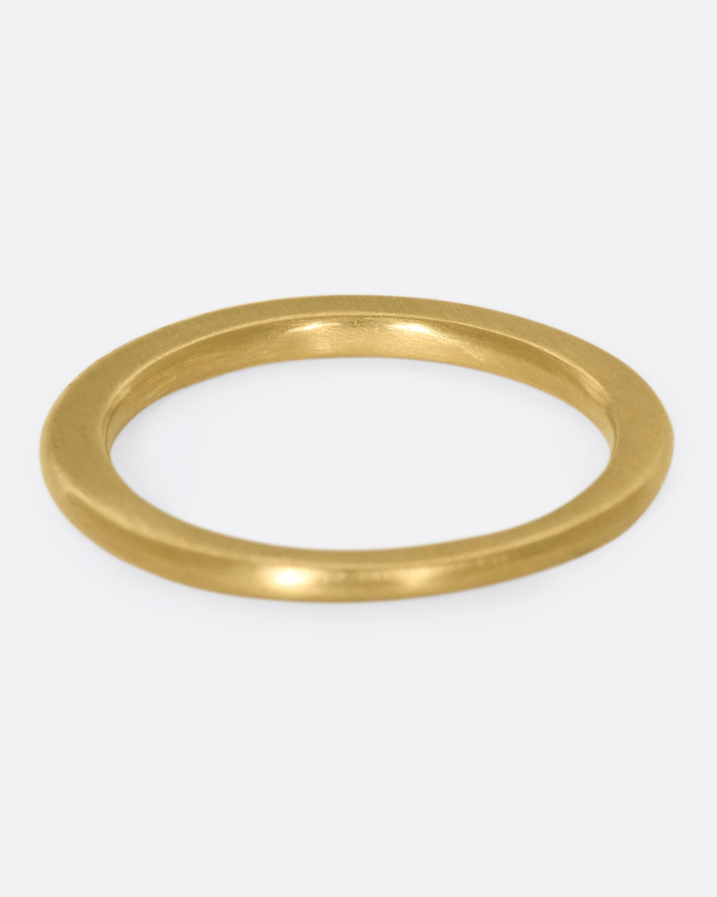 A 10k gold band with light and dark blue sapphires