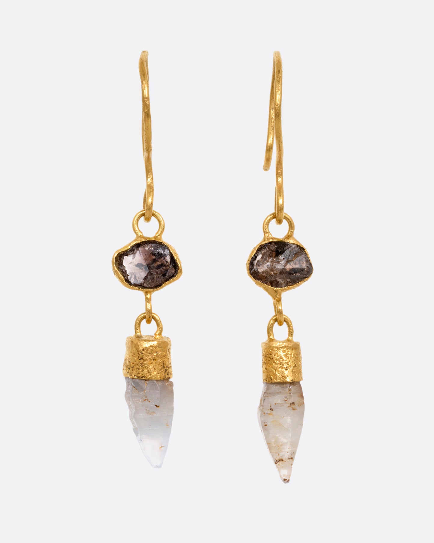 A pair of yellow gold drop earrings with Borneo diamonds and Sri Lanken sapphires, shown from the front.