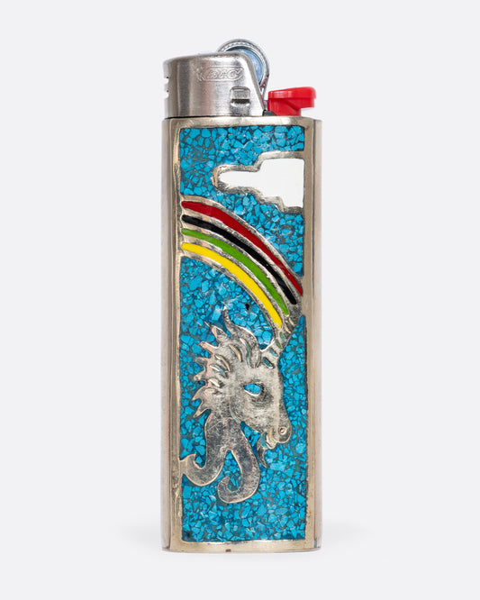 An alpaca silver lighter cover with a unicorn and rainbow. View from the front.