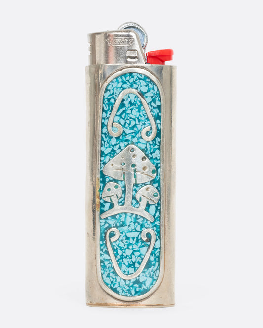 Alpaca silver lighter cover with turquoise chips and magic mushrooms. View from the front.