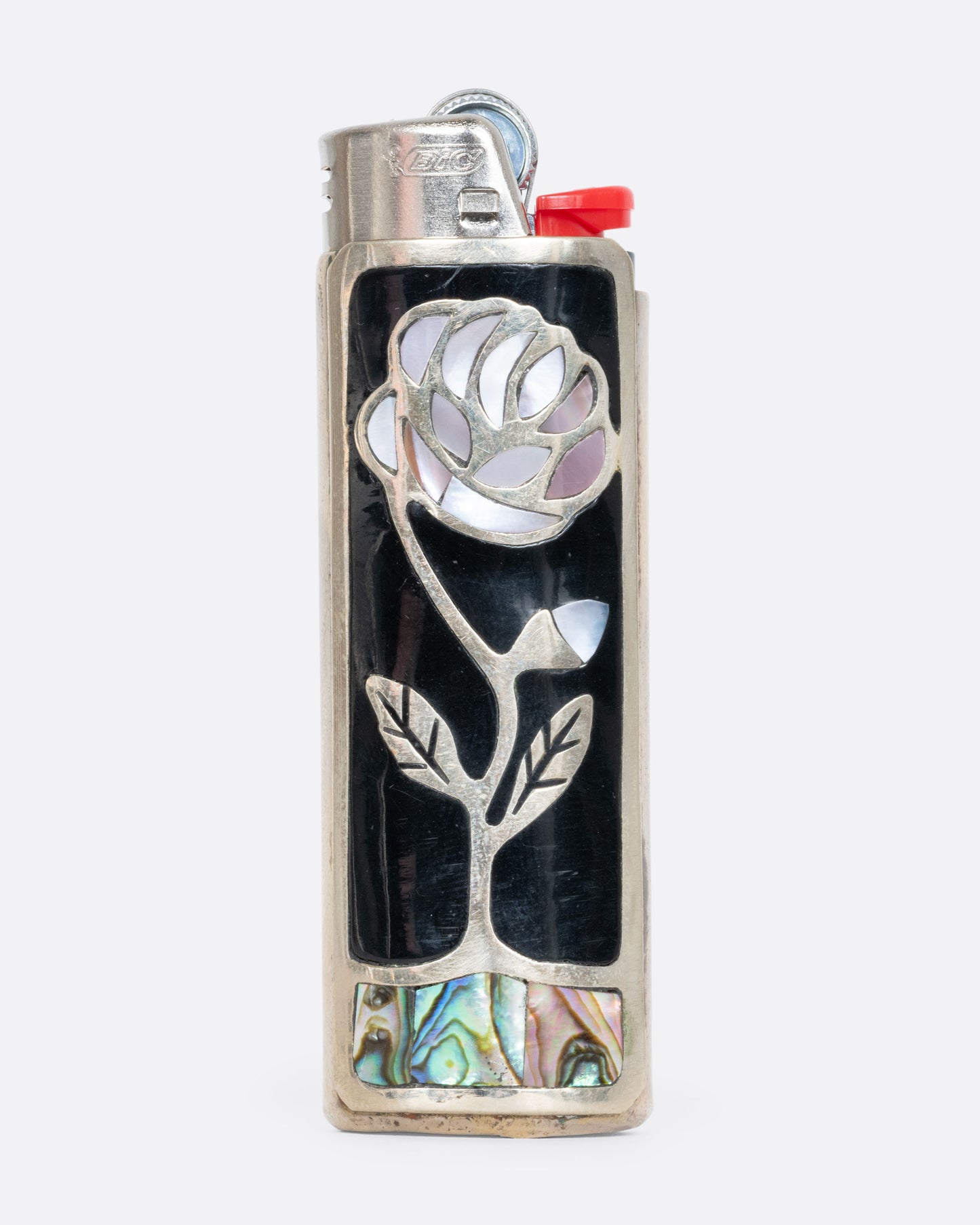 Alpaca silver lighter cover with a mother of pearl rose and abalone inlay. View from the front.