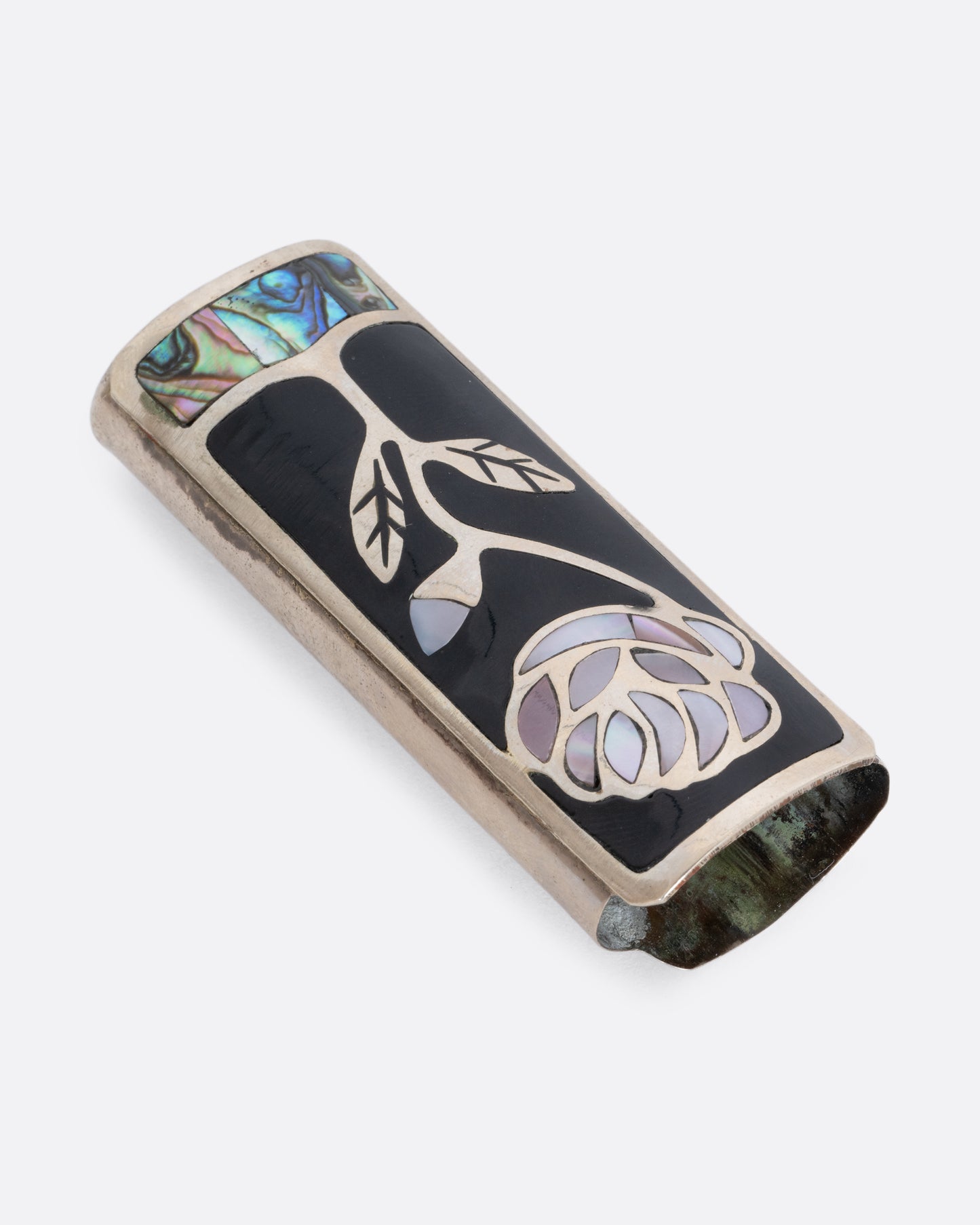 Alpaca silver lighter cover with a mother of pearl rose and abalone inlay. View laying flat.