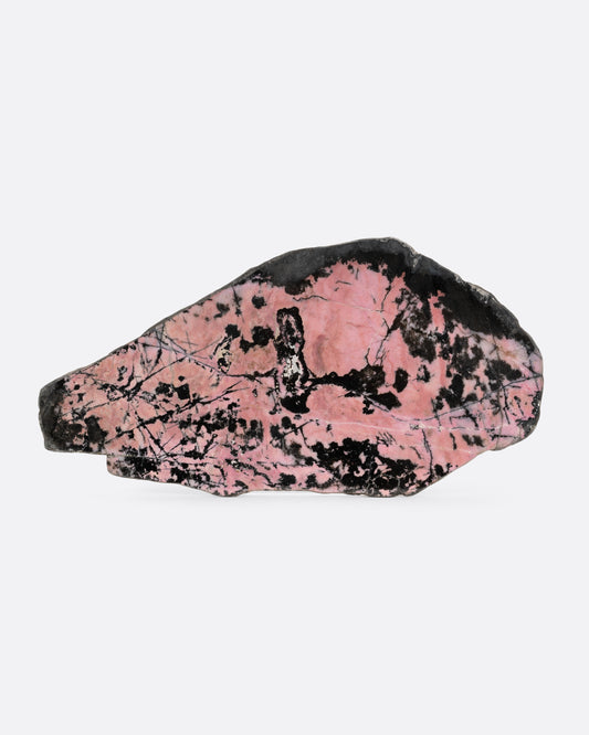 A pink and black stone slab. Shown from the front.