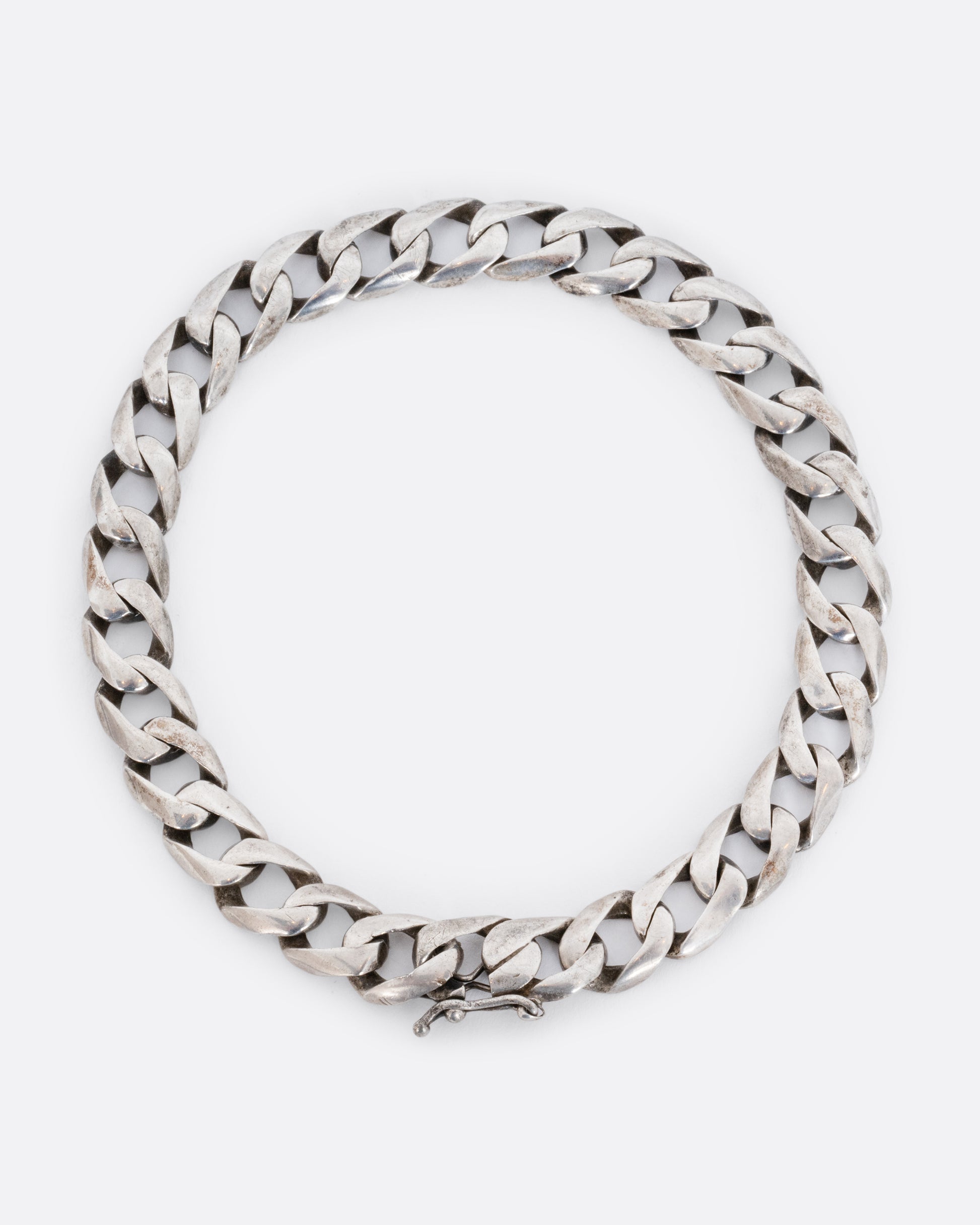 Sterling silver flat curb chain bracelet. Shown from above.