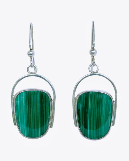 Sterling silver curved drop earrings with malachite. View from the front.