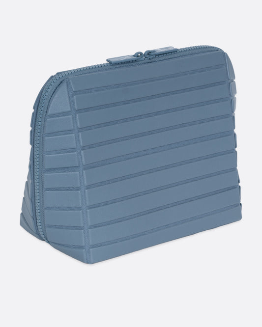 A blue textured rectangular pouch, shown from the side.