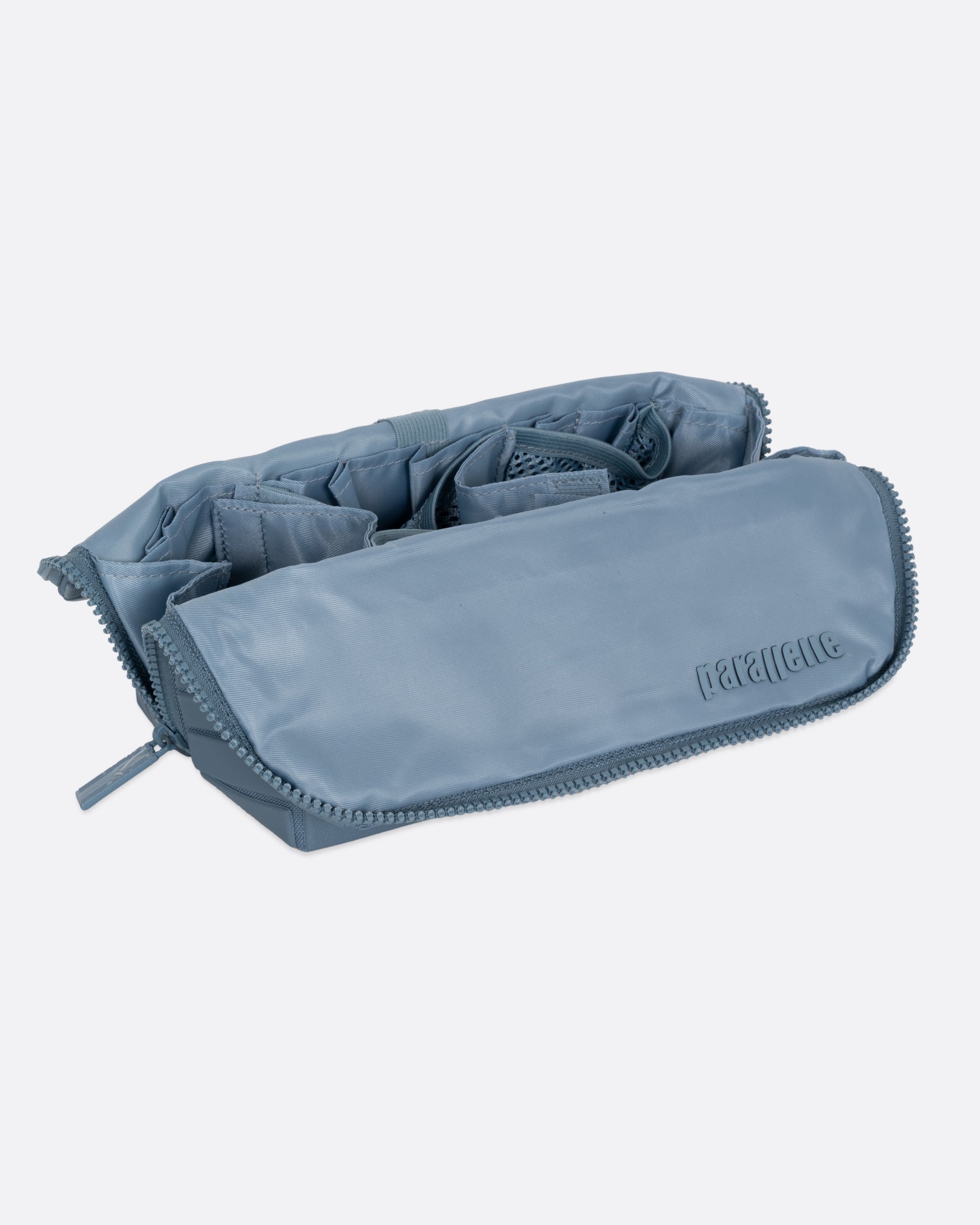 A blue textured rectangular pouch, shown open from the side.