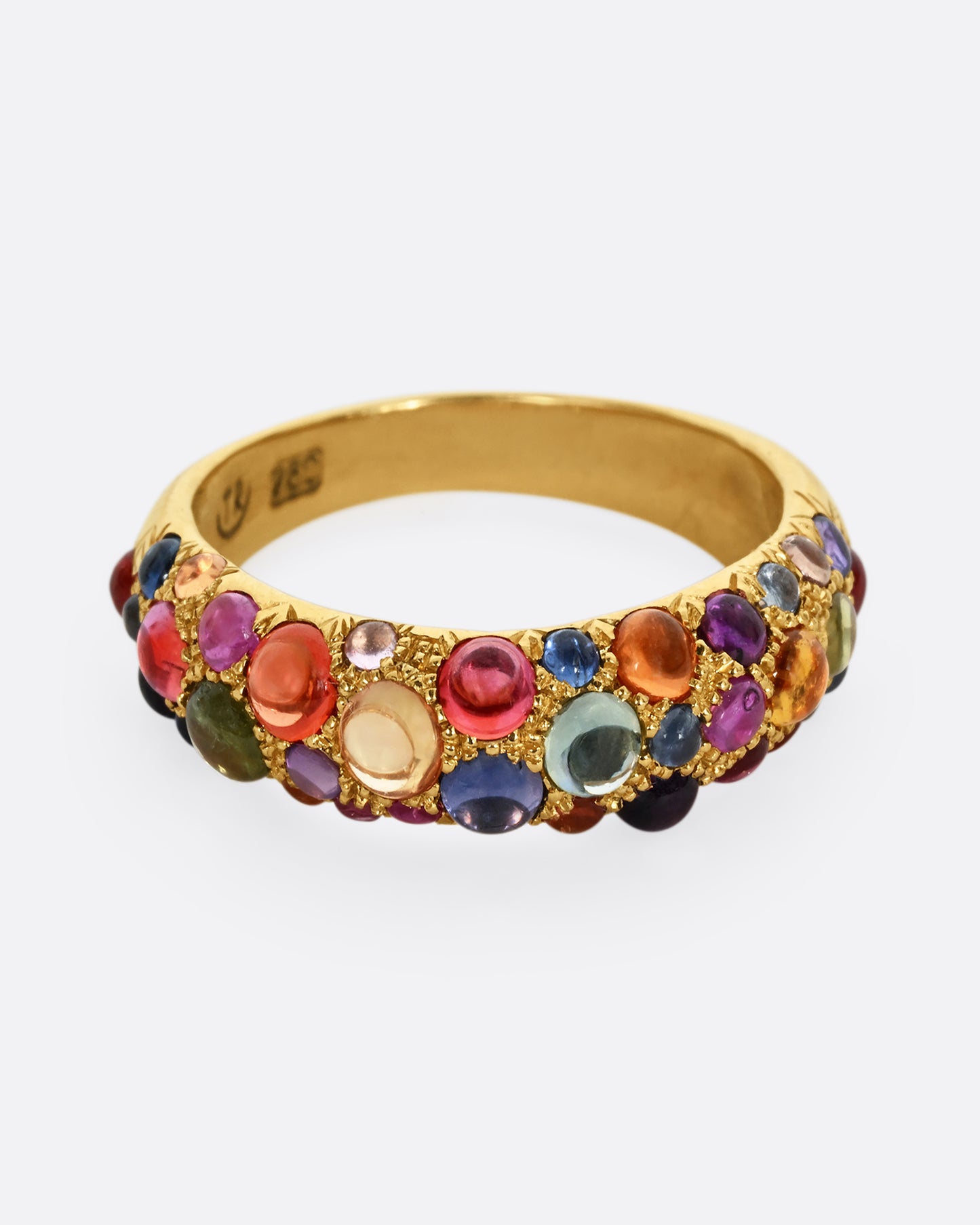 Multicolor sapphire cabochons set in an 18k yellow gold band. Shown from the front.