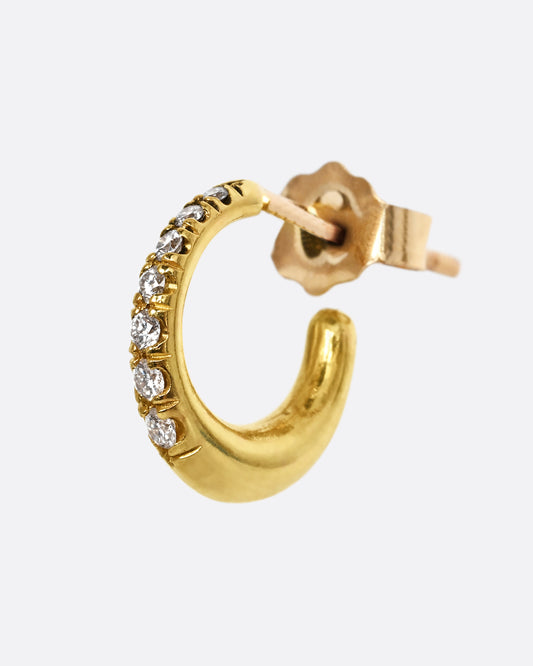 A yellow gold earring with graduated diamonds. Shown from the side.