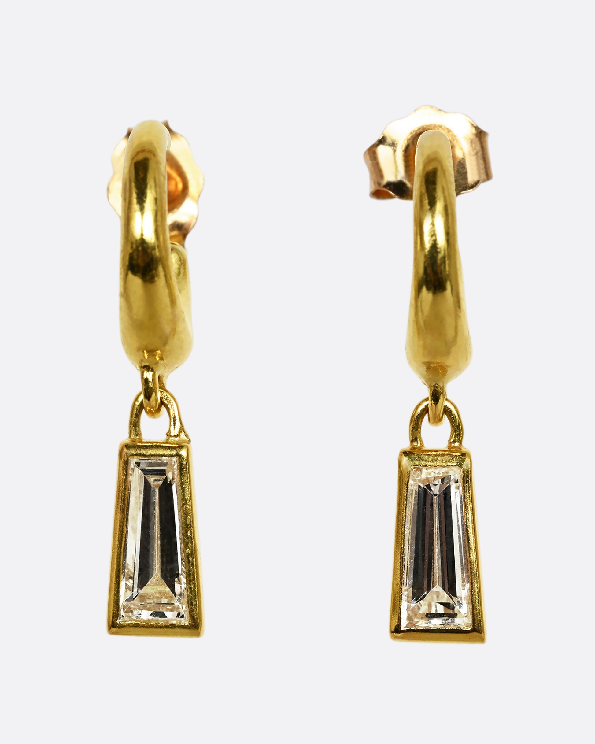 A yellow gold hoop earring with a diamond dangle, shown as a pair from the front.