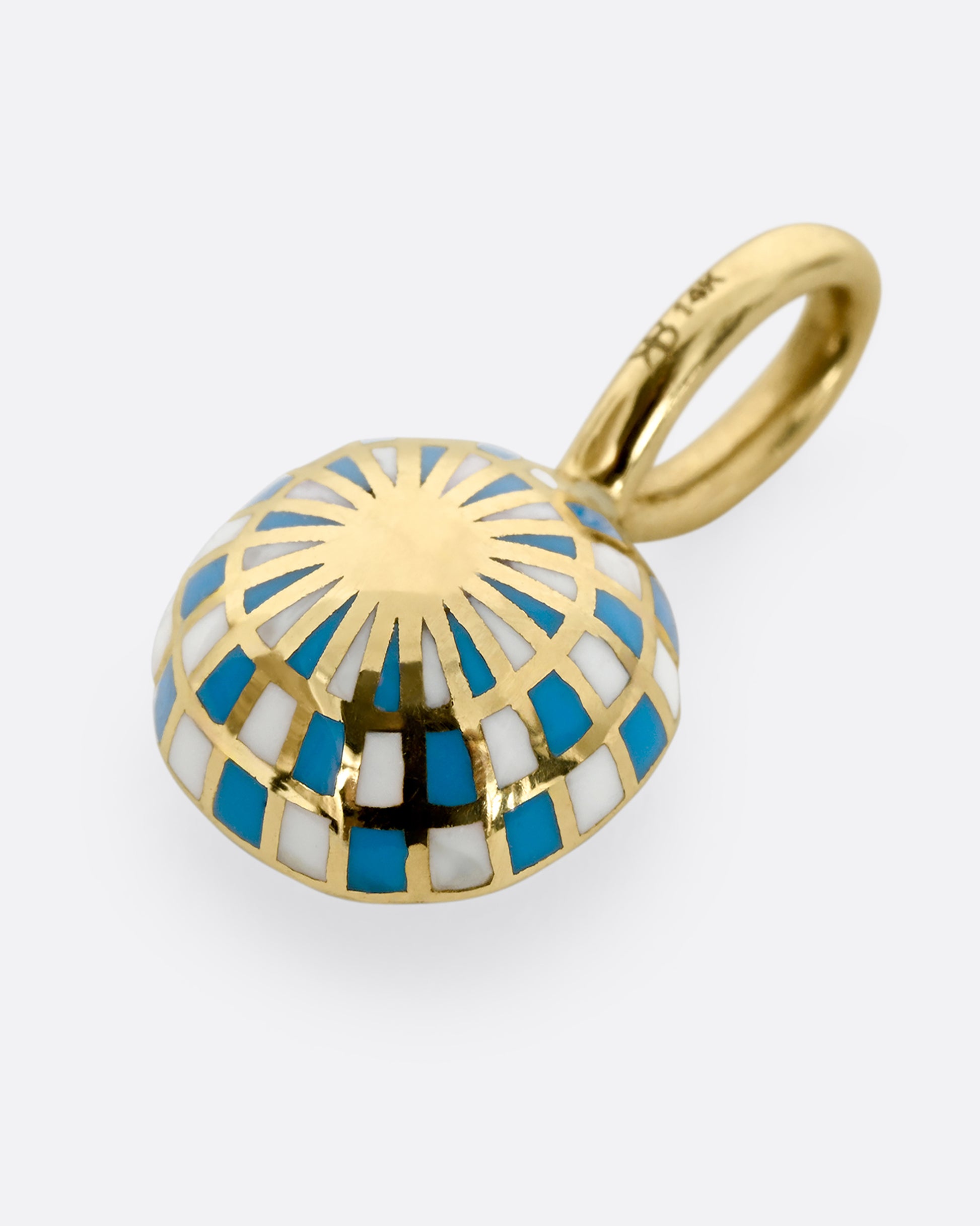 A yellow gold pendant with blue enamel surrounding a cushion cut yellow sapphire. Shown from the back, laying flat.