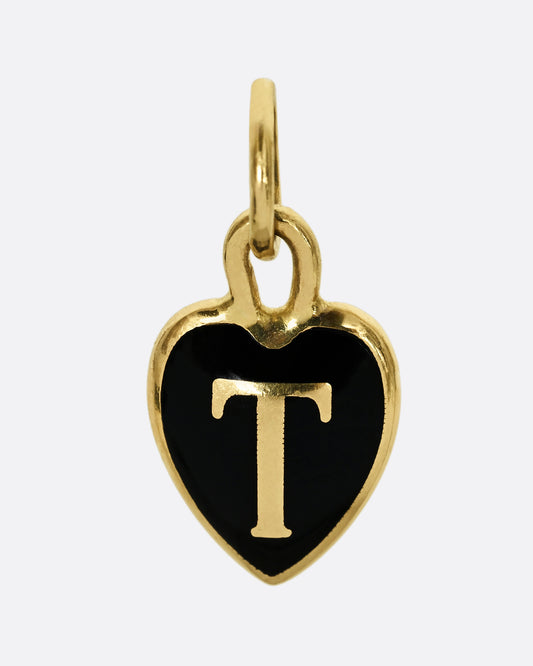 A yellow gold letter "T" heart shaped charm with black enamel. Shown from the front.