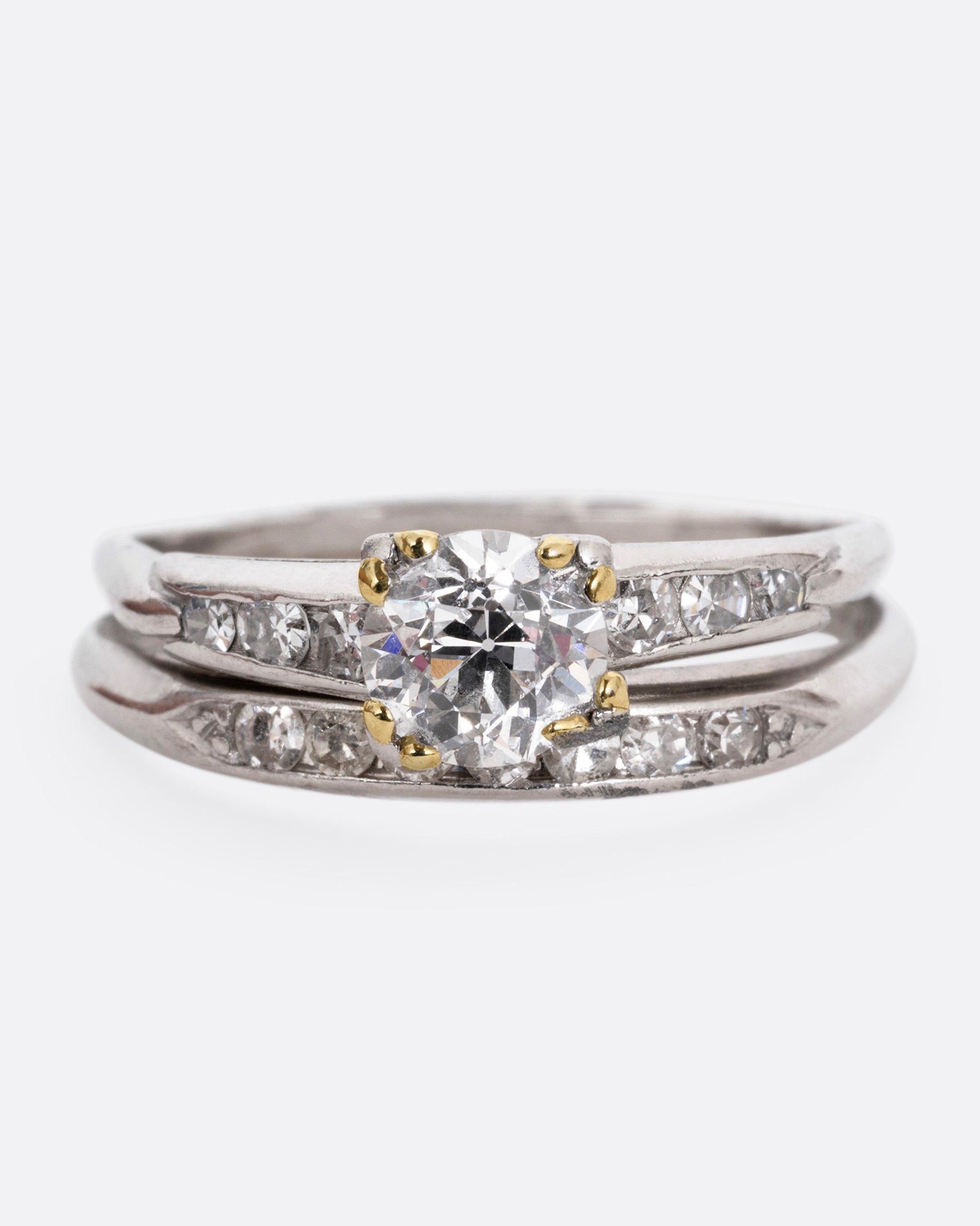 A platinum ring with an Old European cut diamond and a split shank, shown from the front.